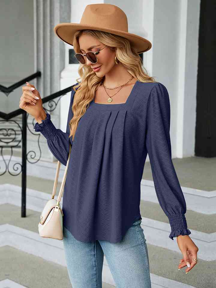 Blusa con cuello cuadrado y manga abullonada