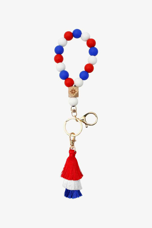 Porte-clés avec bracelet en perles de silicone à pampilles contrastées