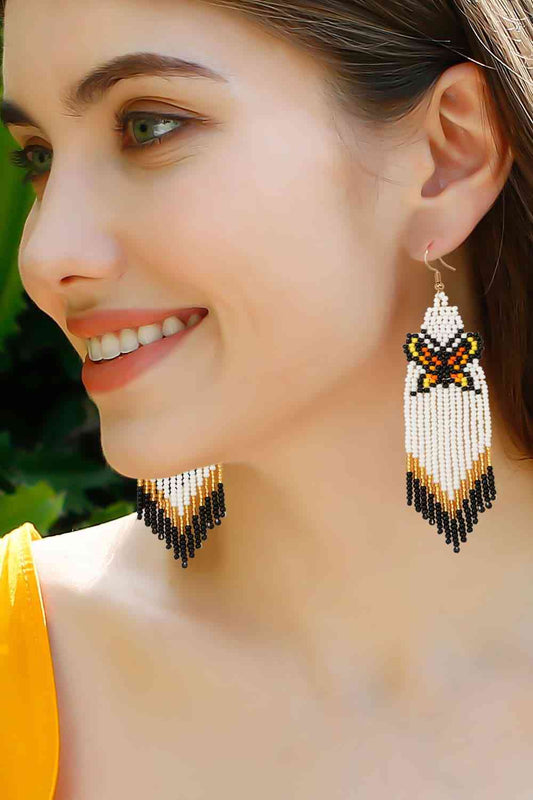 Boucles d'oreilles pendantes en perles papillon