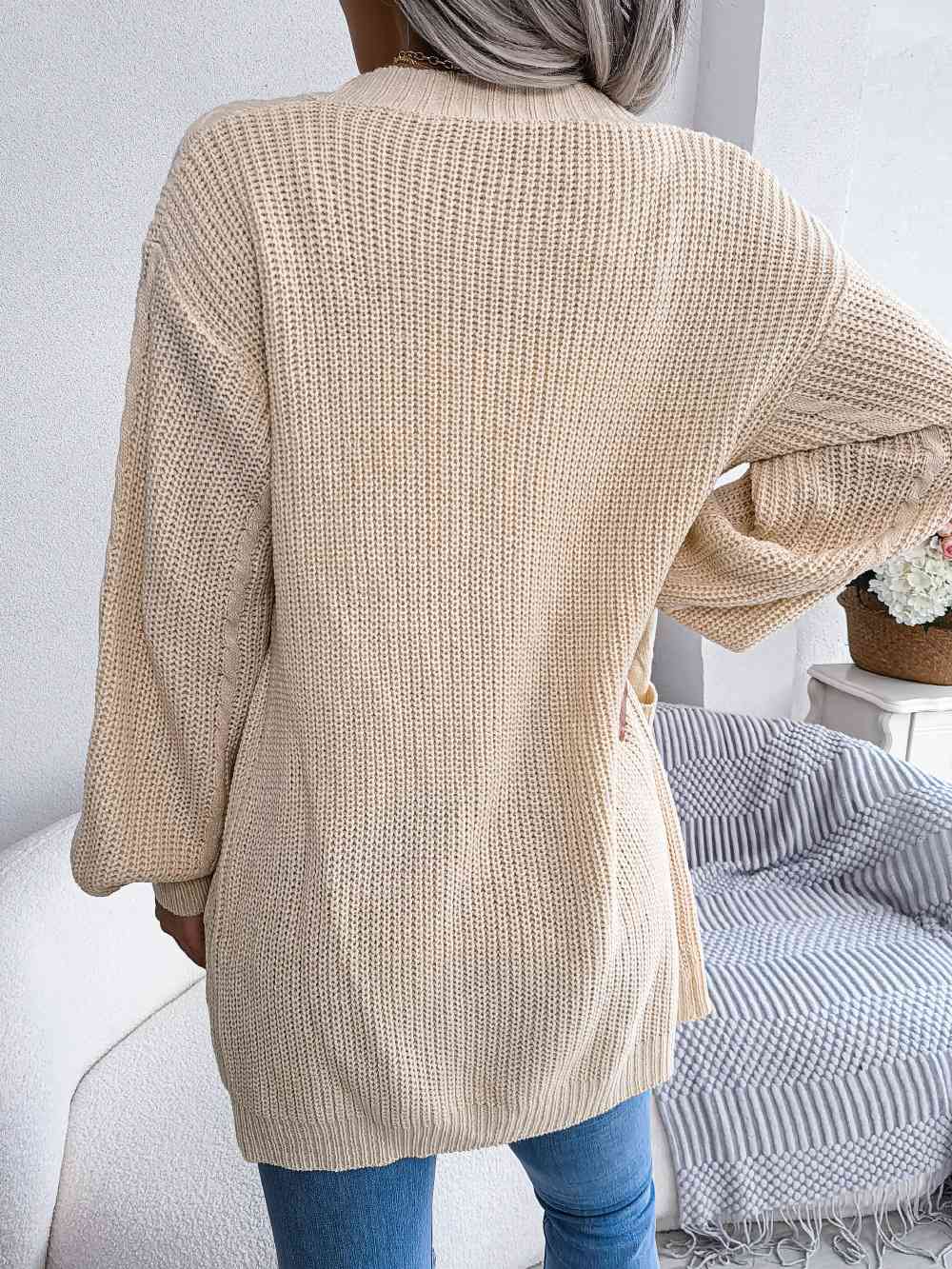 Cardigan ouvert avec poches sur le devant en tricot torsadé