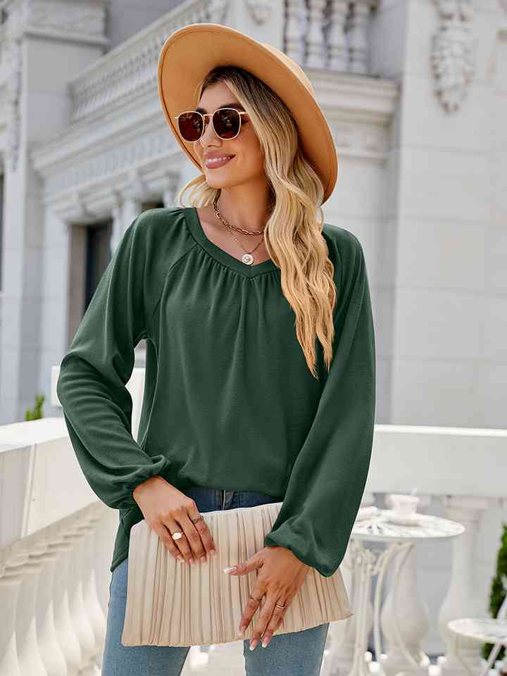 Blusa de manga larga con cuello en V