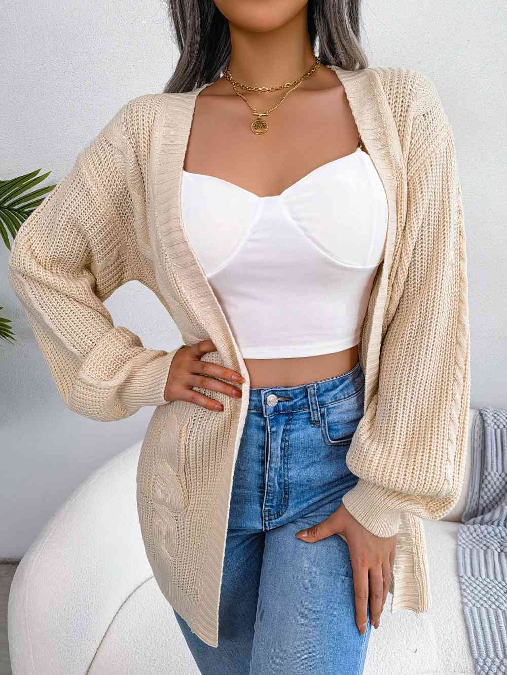 Cardigan ouvert avec poches sur le devant en tricot torsadé