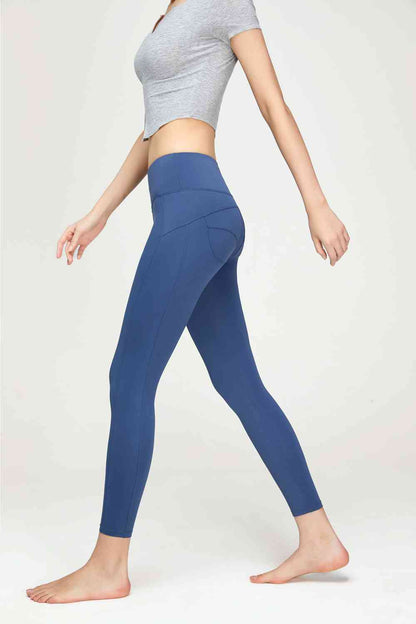 Leggings de sport à large ceinture et détails de couture