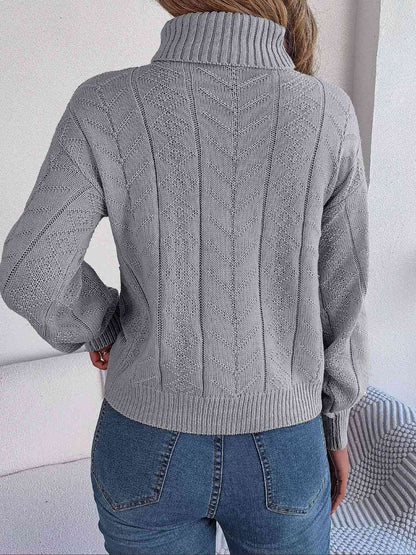 Pull à col roulé en tricot torsadé