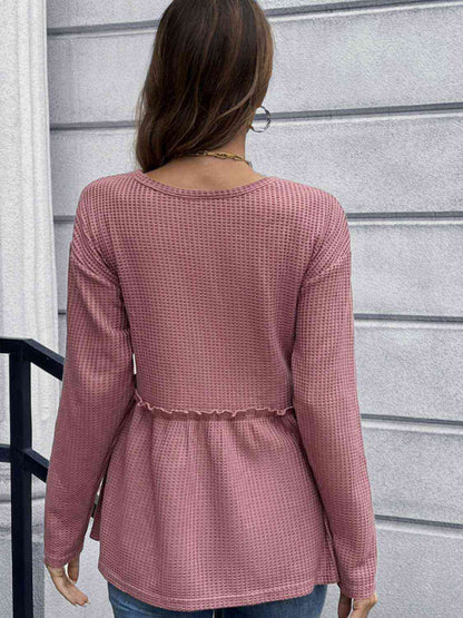 Blouse péplum à manches longues en tricot gaufré