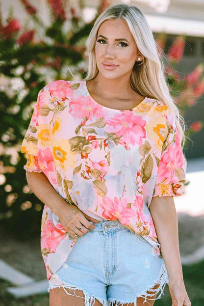 Top floral con cuello redondo y manga tres cuartos