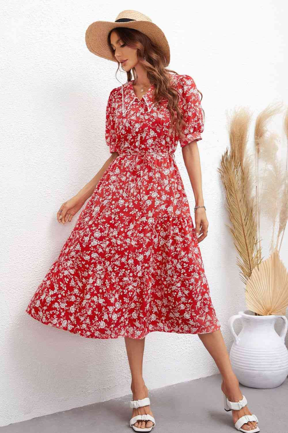 Robe mi-longue florale à manches bouffantes et taille nouée