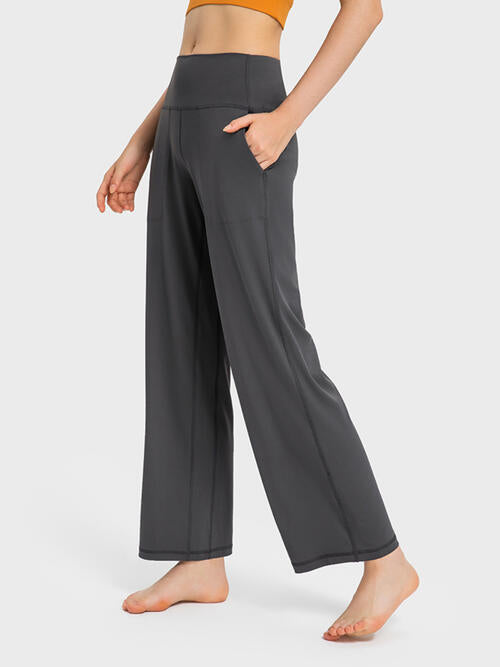 Pantalones activos de cintura ancha con bolsillos