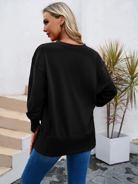 Sudadera con cuello redondo y abertura