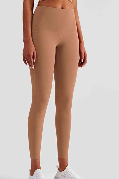 Leggings deportivos de cintura ancha con bolsillos laterales