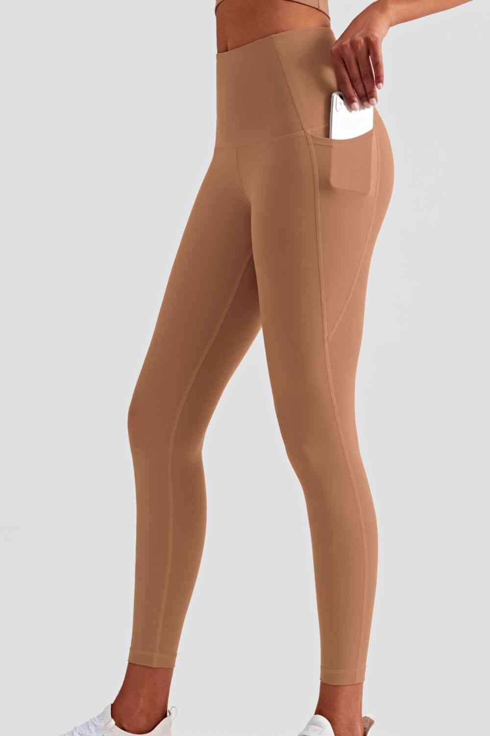 Leggings deportivos de cintura ancha con bolsillos laterales