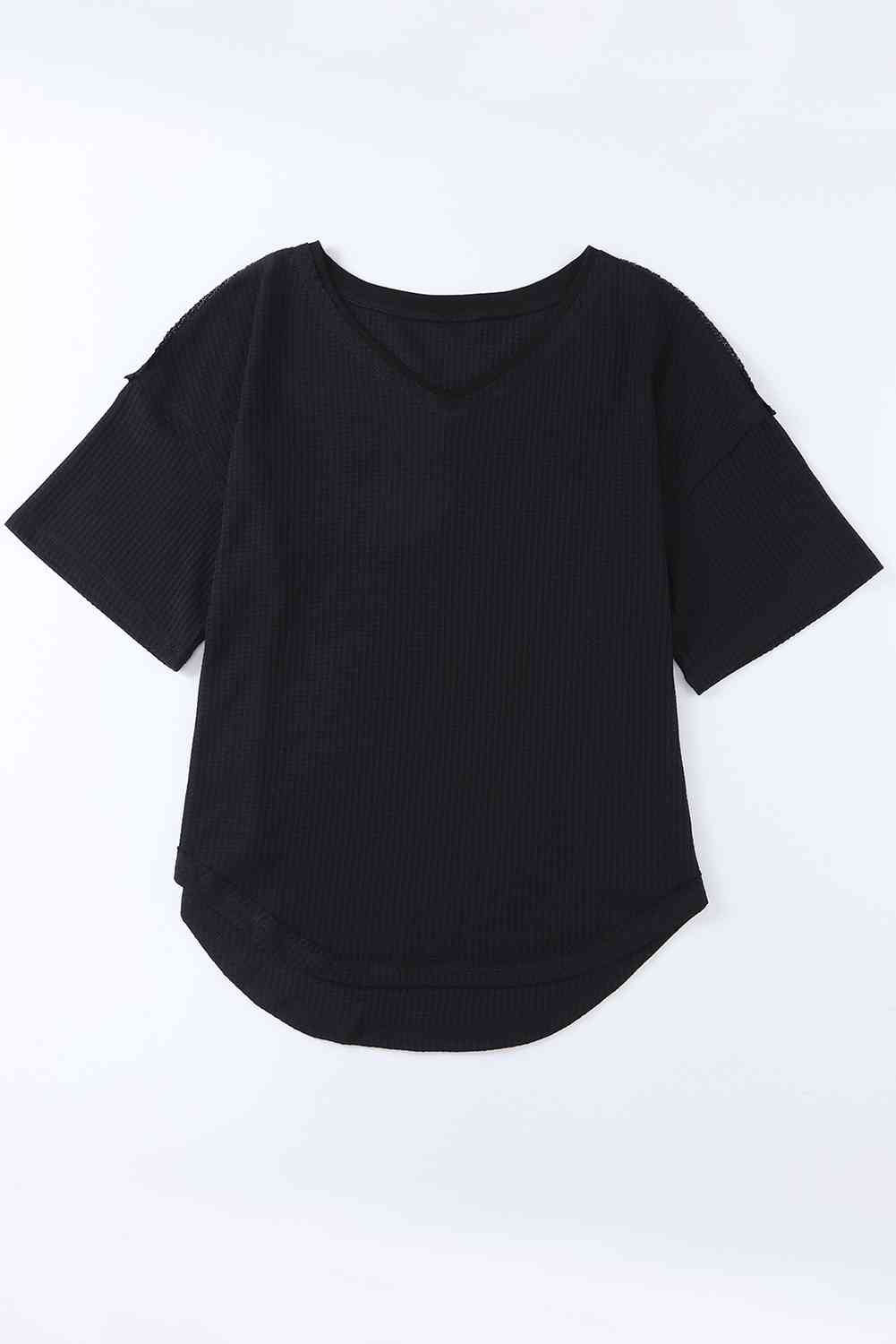 Blusa de hombros caídos con cuello en V y punto tipo gofre