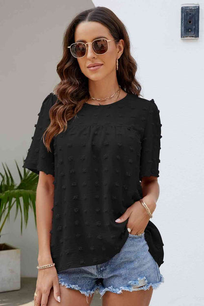 Blusa con cuello redondo y mangas abullonadas con lunares suizos