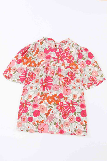 Blusa floral con mangas abullonadas y anudada