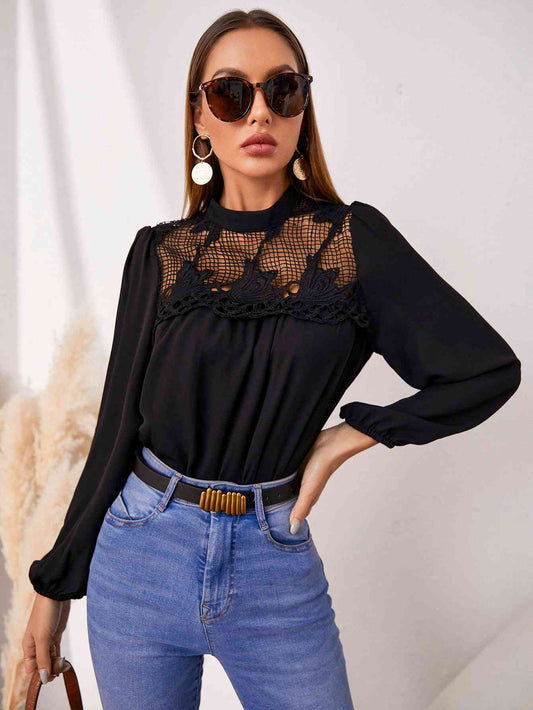 Blouse ajourée à col rond et manches bouffantes