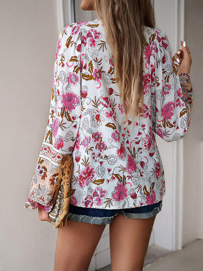 Blouse florale à manches bouffantes et col noué