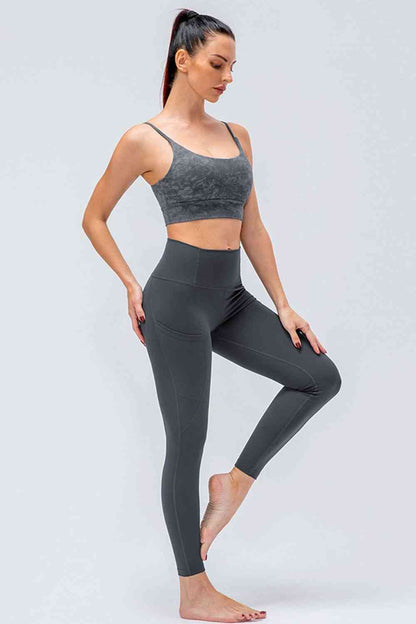 Leggings activos transpirables con cintura ancha y bolsillos