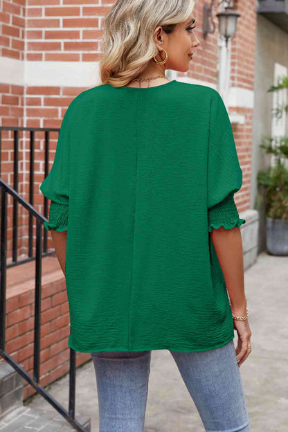 Blusa con cuello redondo y mangas farol fruncidas