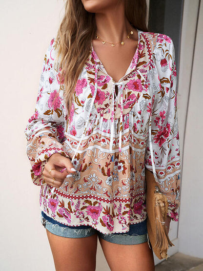 Blouse florale à manches bouffantes et col noué