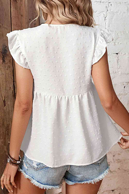 Blusa peplum con manga acampanada y cuello anudado con lunares suizos