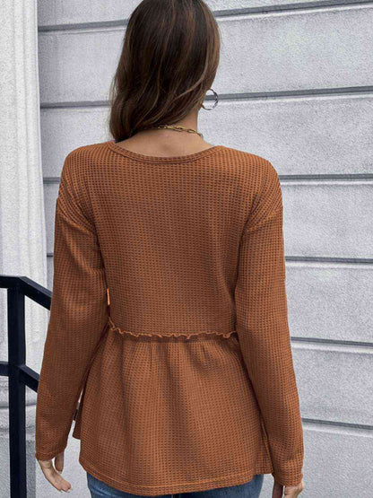 Blouse péplum à manches longues en tricot gaufré