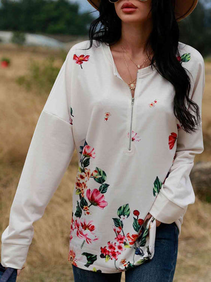 Blusa con cremallera delantera y hombros caídos con estampado floral