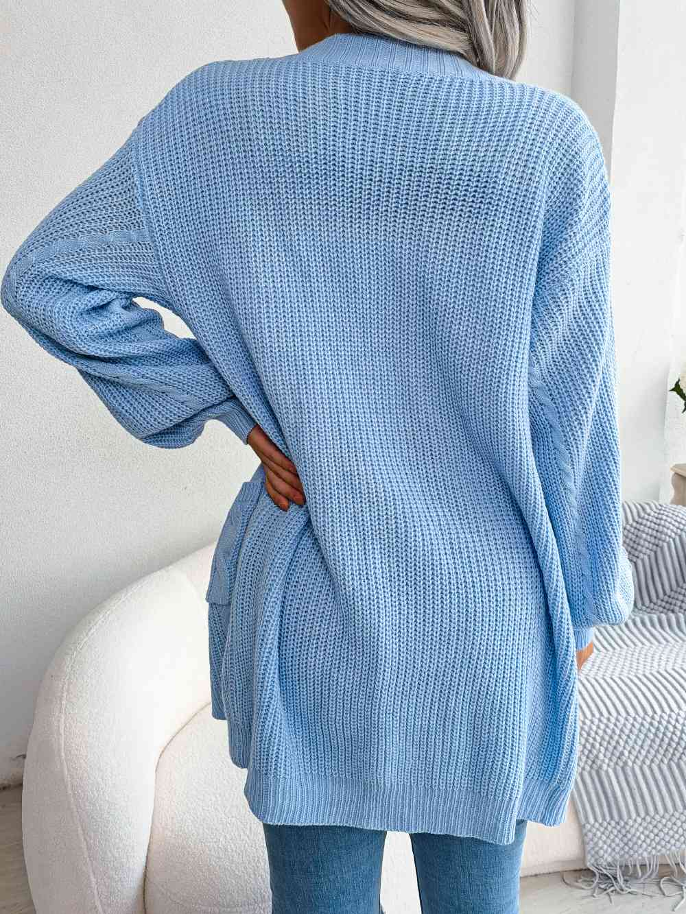 Cardigan ouvert avec poches sur le devant en tricot torsadé