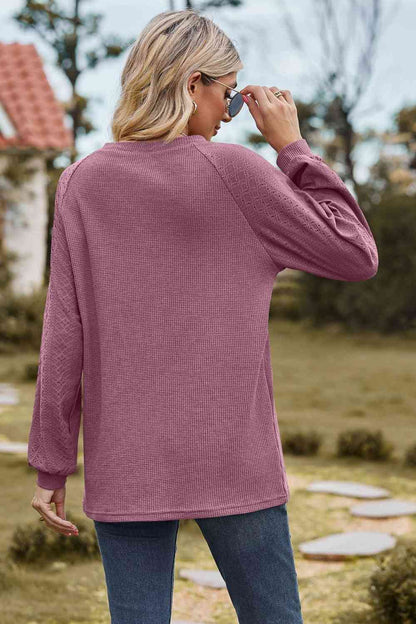 Sudadera con cuello redondo y manga raglán