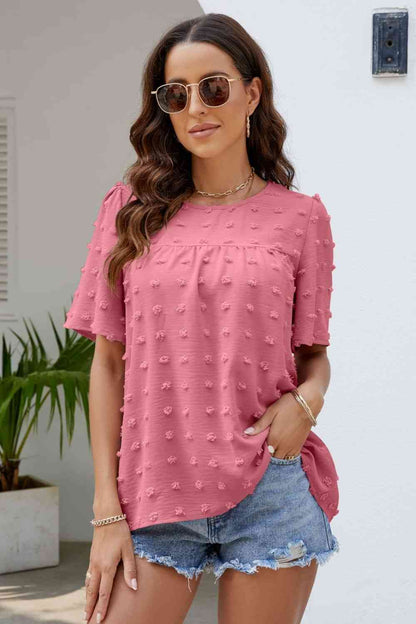 Blusa con cuello redondo y mangas abullonadas con lunares suizos