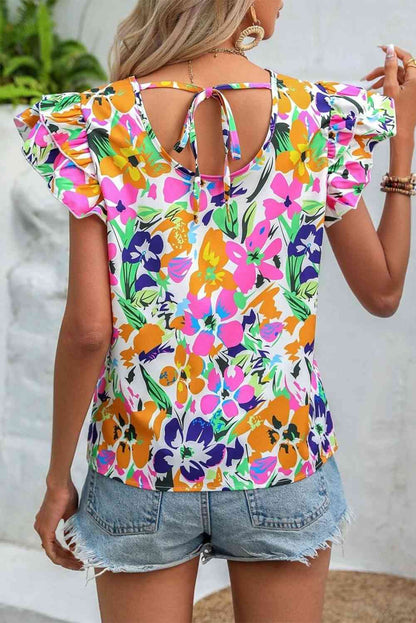 Blusa con mangas acampanadas y lazo floral en la espalda