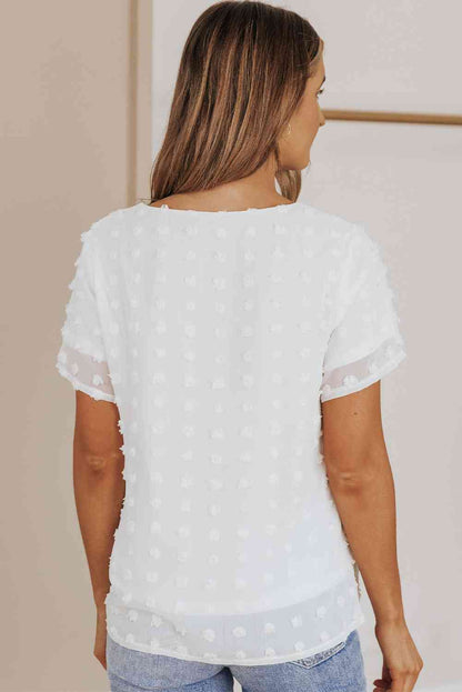 Blusa con cuello redondo y lunares suizos