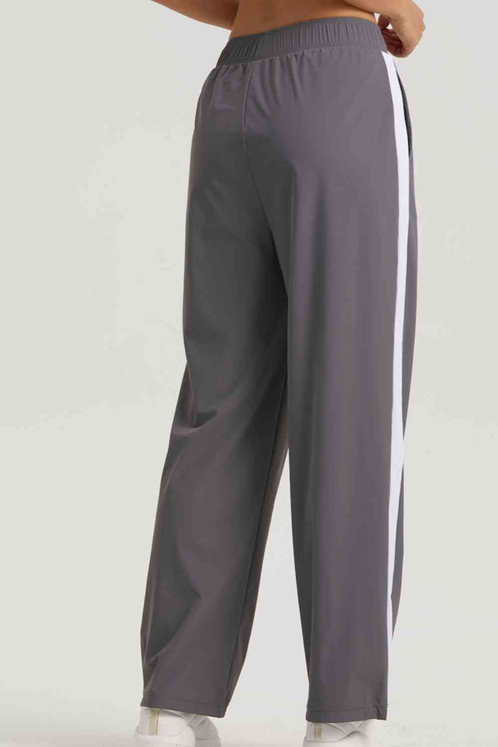 Pantalon de sport à taille élastique à rayures latérales