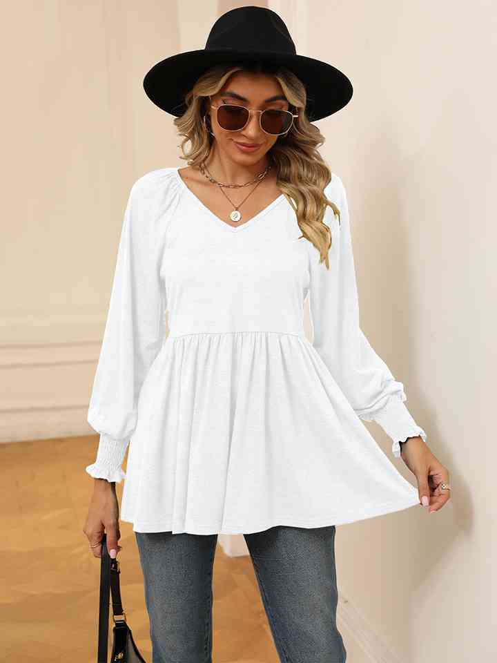 Blusa con mangas farol y cuello en V