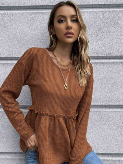 Blouse péplum à manches longues en tricot gaufré