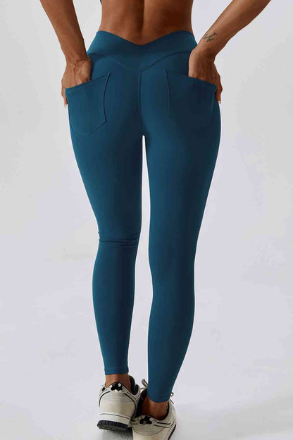 Legging de sport coupe slim avec large ceinture et poche arrière