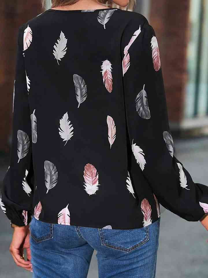 Blusa estampada de manga larga con cuello con muescas