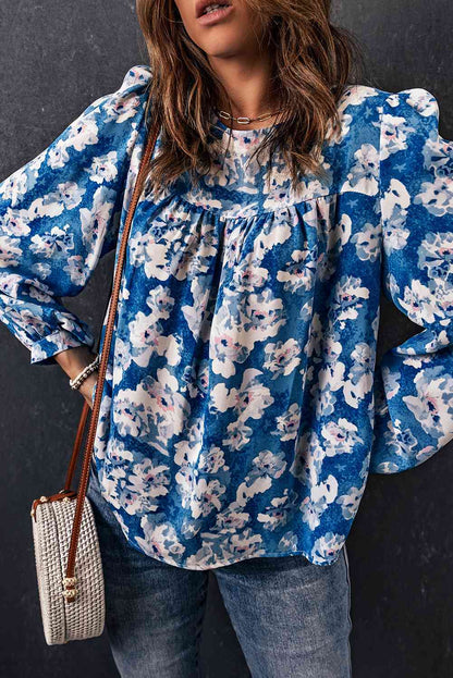 Blusa floral con cuello redondo y manga globo