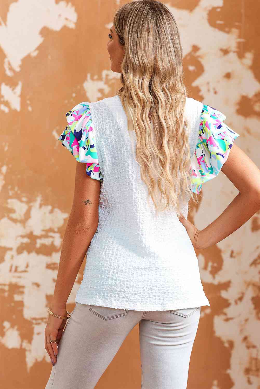 Blusa con cuello redondo y mangas acampanadas multicolor