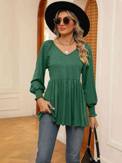 Blusa con mangas farol y cuello en V