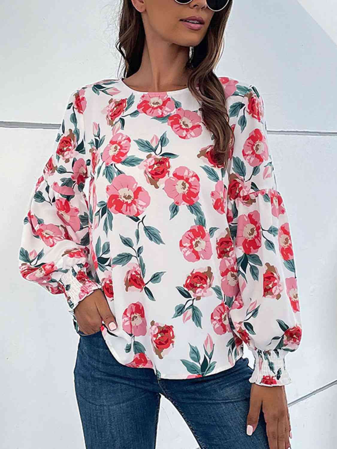 Blouse florale à manches longues bouffantes et col rond