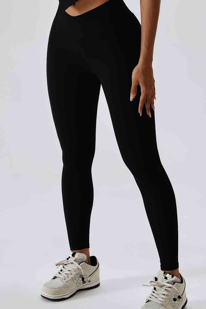 Legging de sport coupe slim avec large ceinture et poche arrière