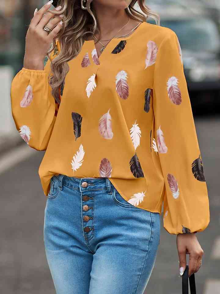 Blusa estampada de manga larga con cuello con muescas