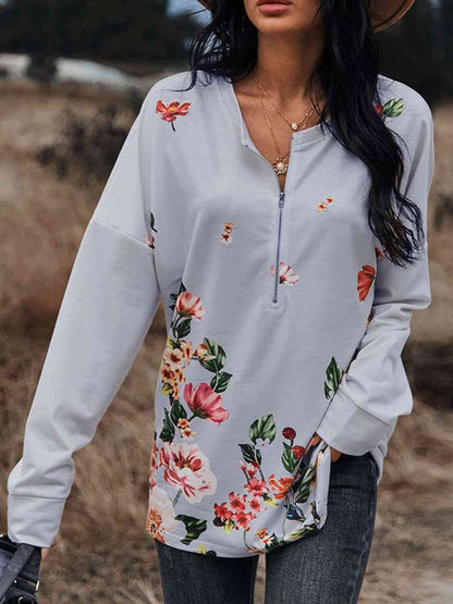 Blusa con cremallera delantera y hombros caídos con estampado floral