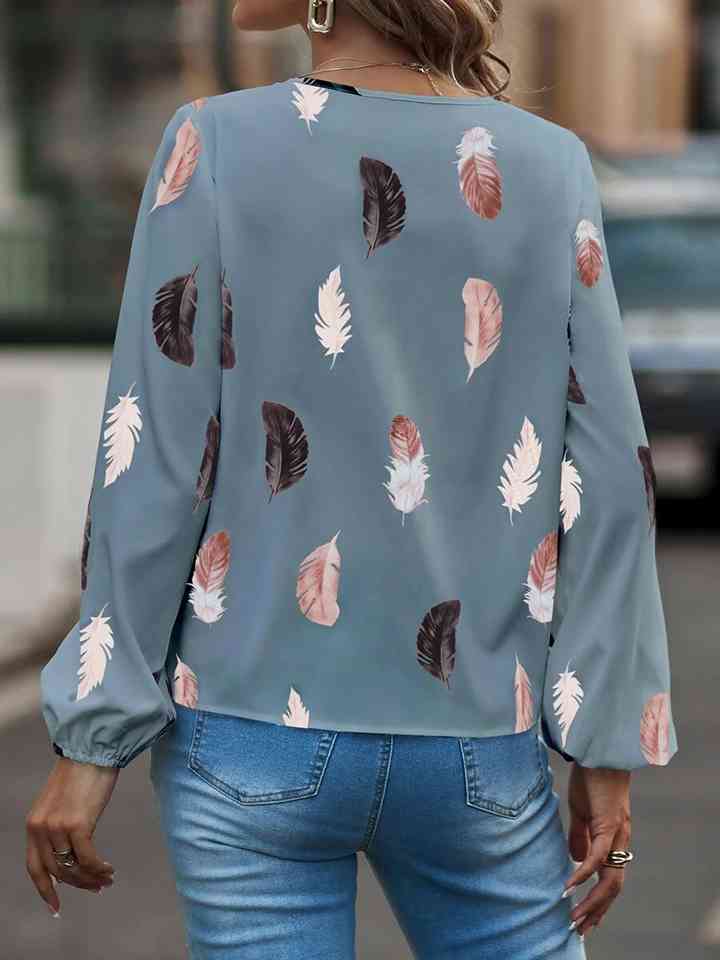 Blusa estampada de manga larga con cuello con muescas