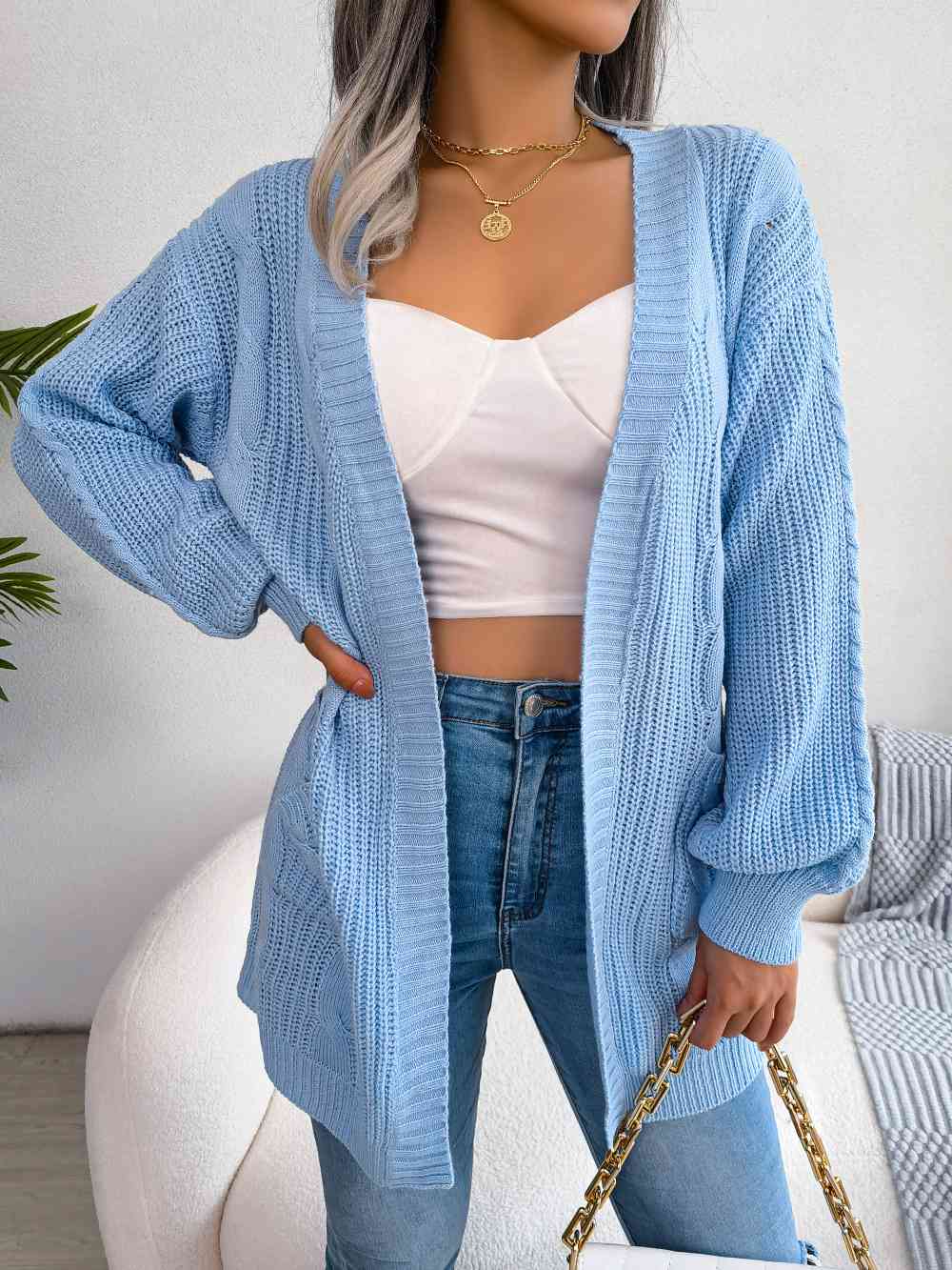 Cardigan ouvert avec poches sur le devant en tricot torsadé