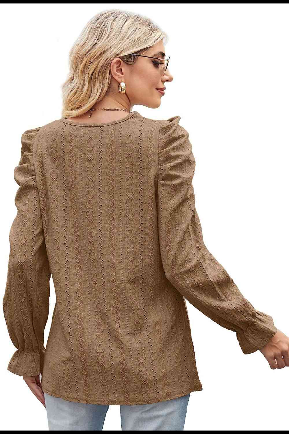 Blouse à manches bouffantes et col rond