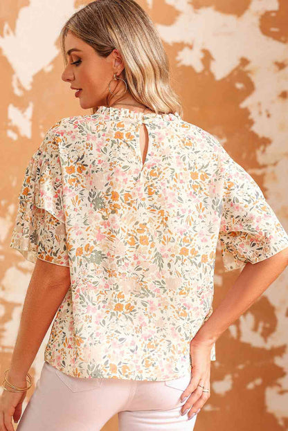 Blusa floral de manga corta con cuello redondo