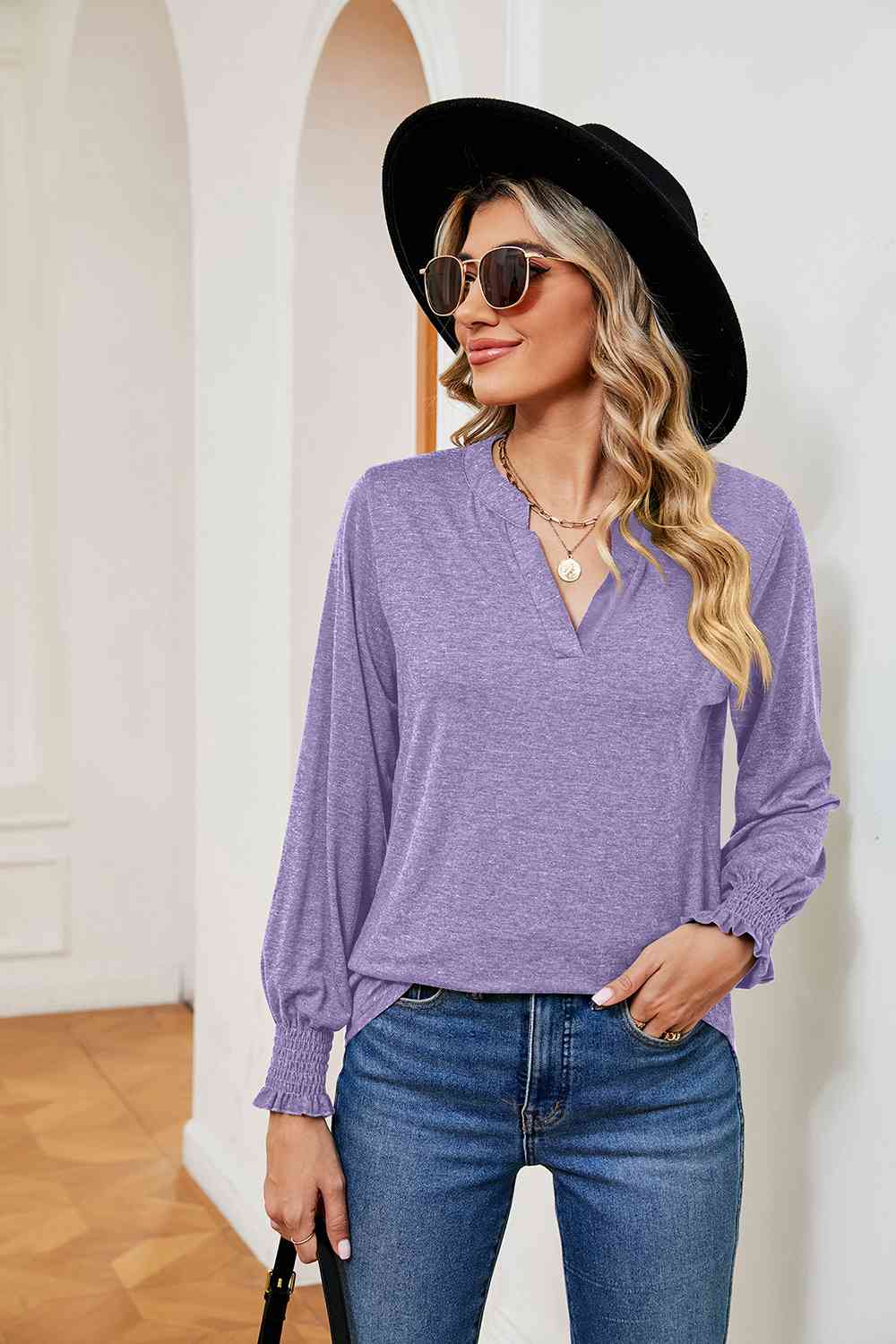 Blusa de manga larga con cuello con muescas