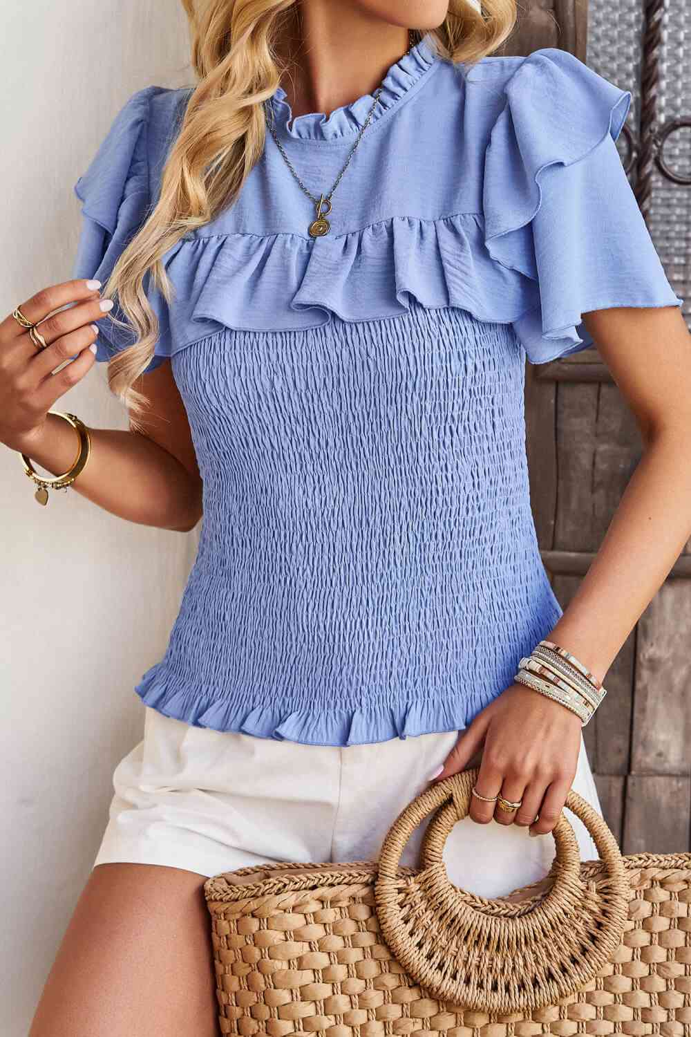 Blouse smockée à manches flottantes et nouée au dos