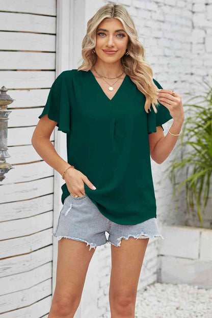 Blusa con mangas acampanadas y cuello en V